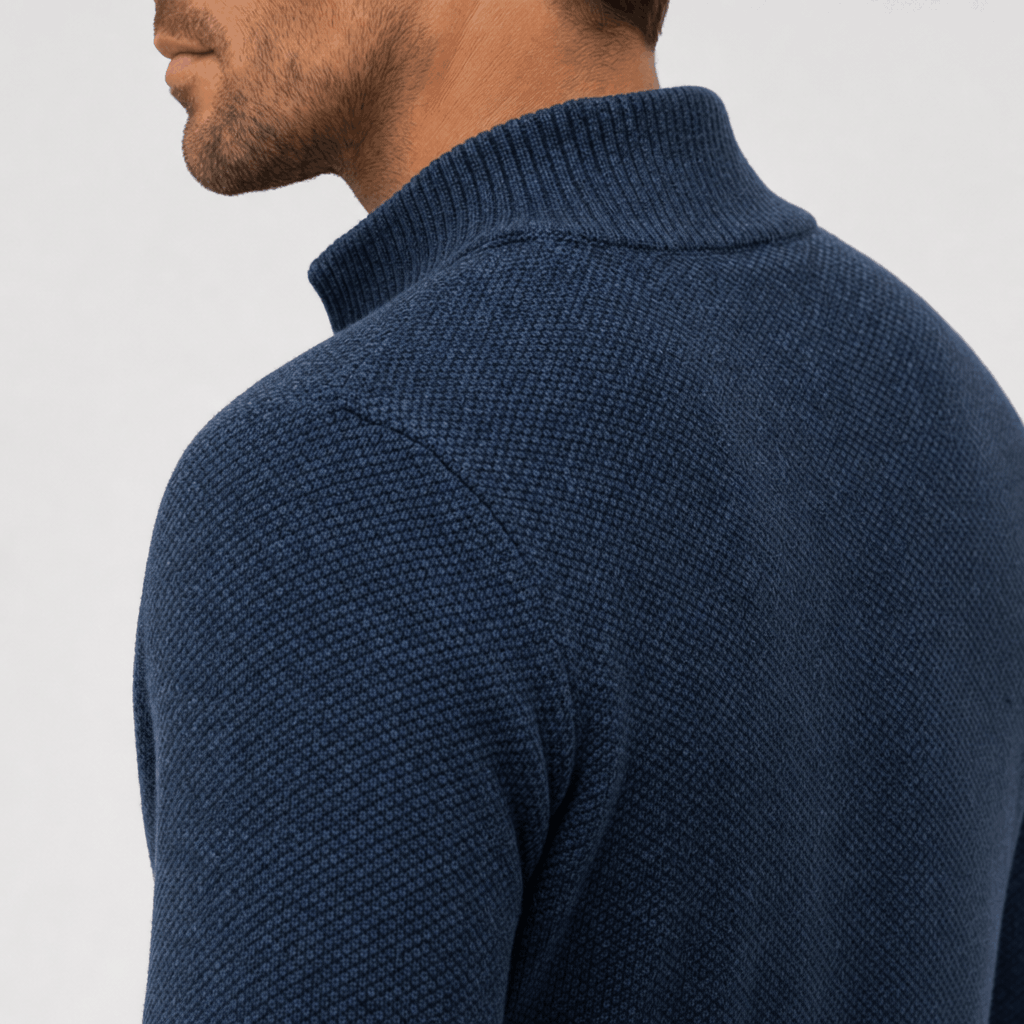 Close-up back view of the navy blue jacket, highlighting the raised collar and textured fabric.
