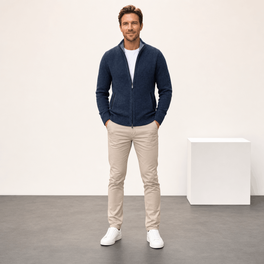 Male model wearing the navy blue jacket with light-colored pants.