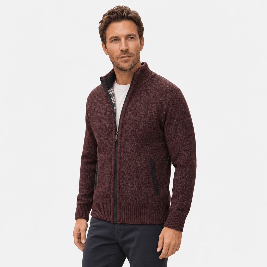 Male model wearing a burgundy textured zip-up jacket.