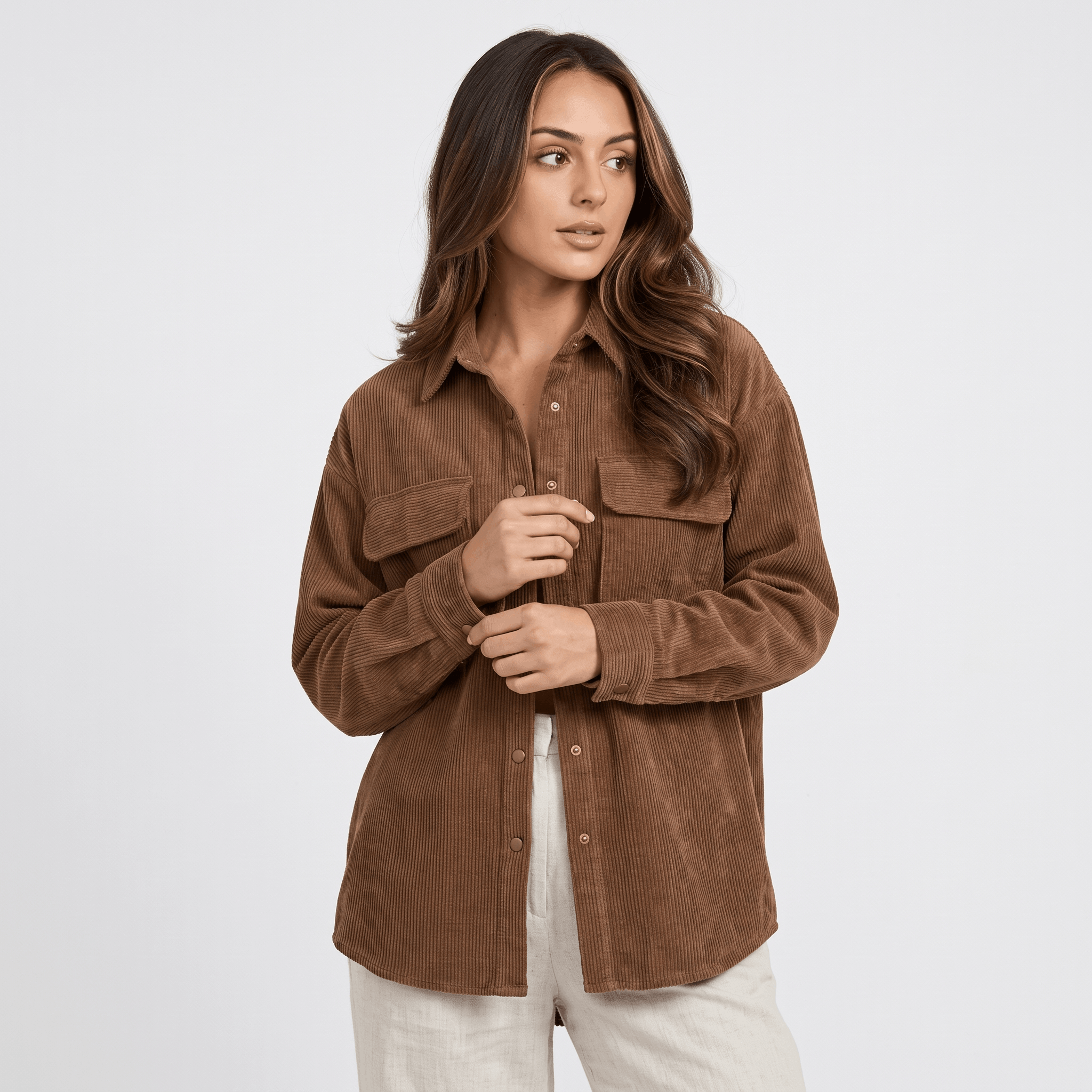 Khaki wide wale corduroy shirt jacket with an oversized fit, drop shoulders, and buttoned chest pockets.