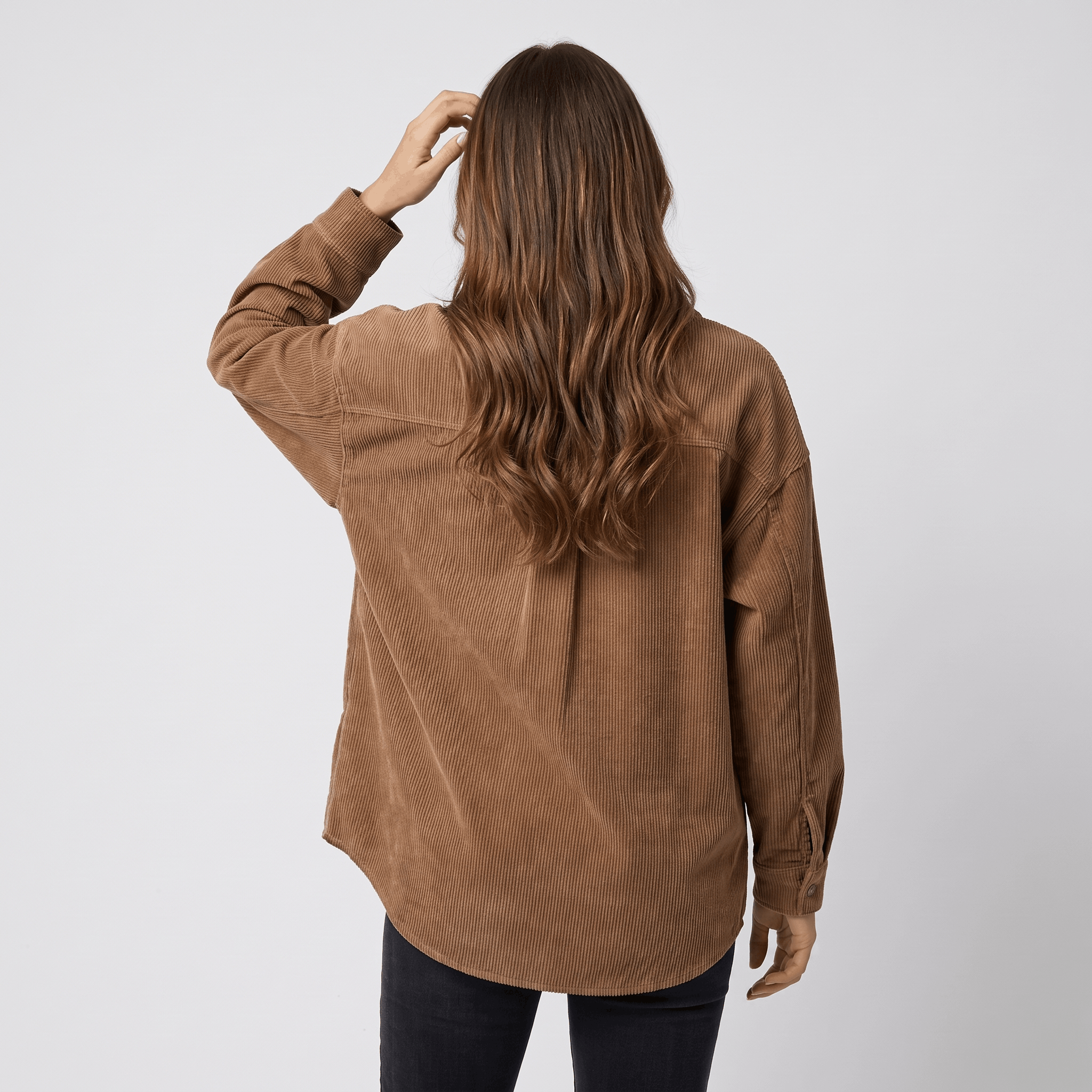 Khaki wide wale corduroy shirt jacket with an oversized fit, dropped shoulders, and a back yoke detail.