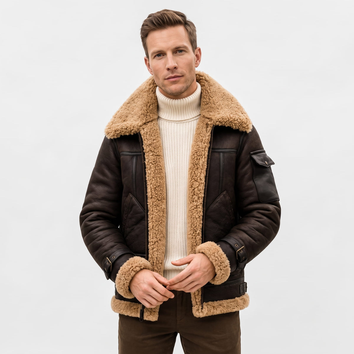 A man wearing a dark brown leather shearling bomber jacket with a sherpa collar, front view