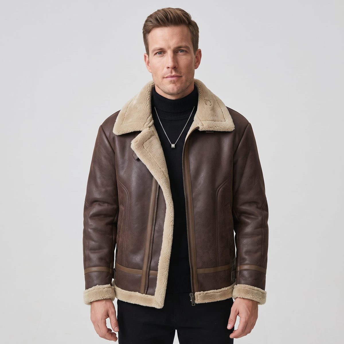 A man wearing a dark brown leather sherpa aviator jacket with fleece lining and zip pockets
