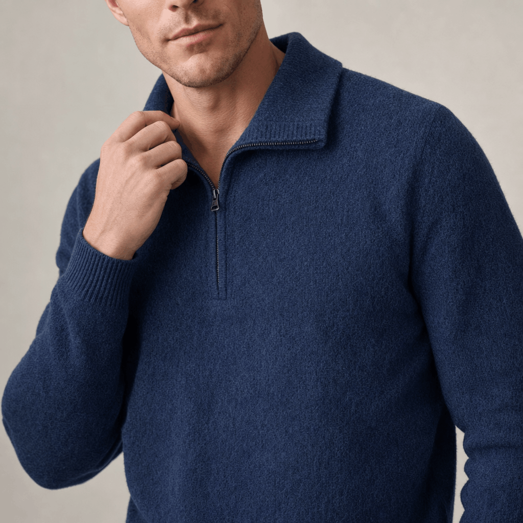 Close-up showing the collar and textured knit detail of the navy blue sweater.