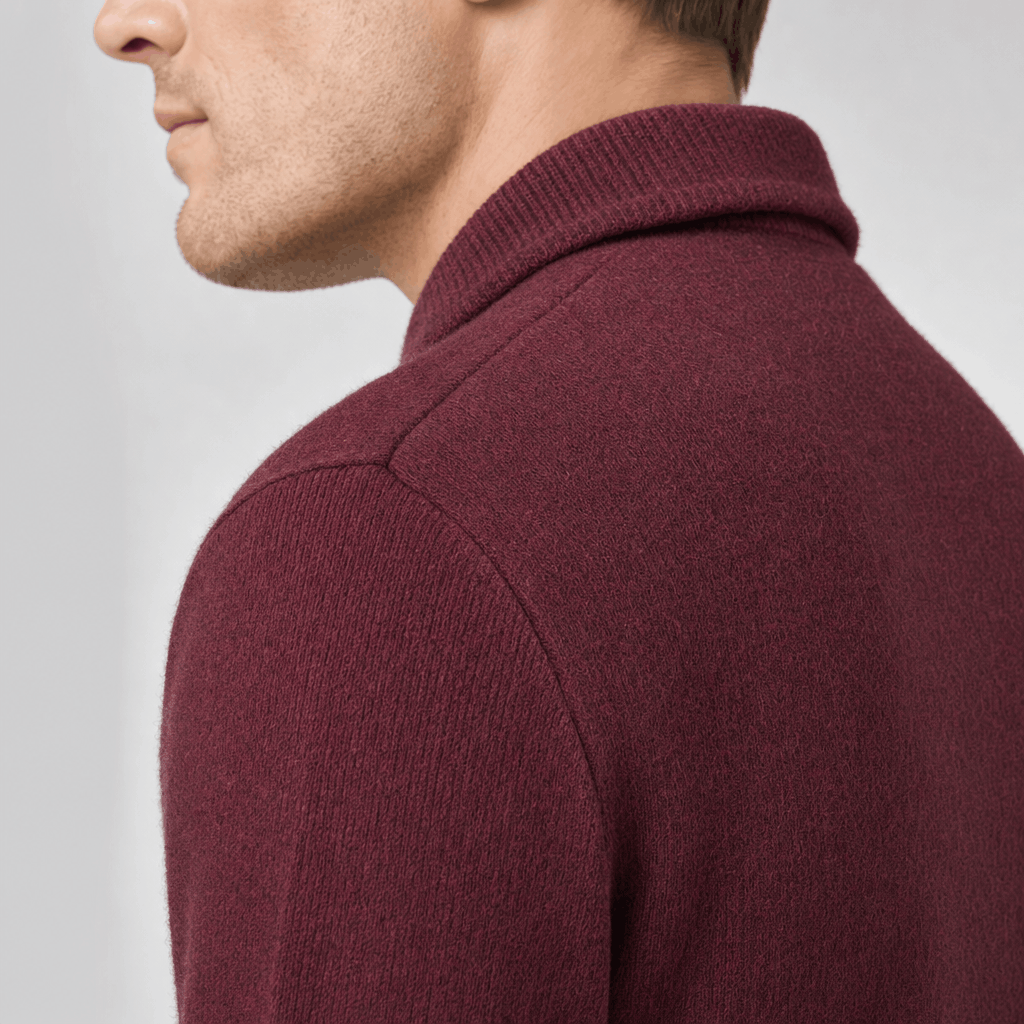 Back close-up showing the raised collar and textured knit of the burgundy sweater.