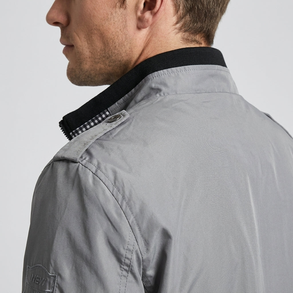 Side and back close-up showing the black collar and shoulder detail of the light gray jacket.
