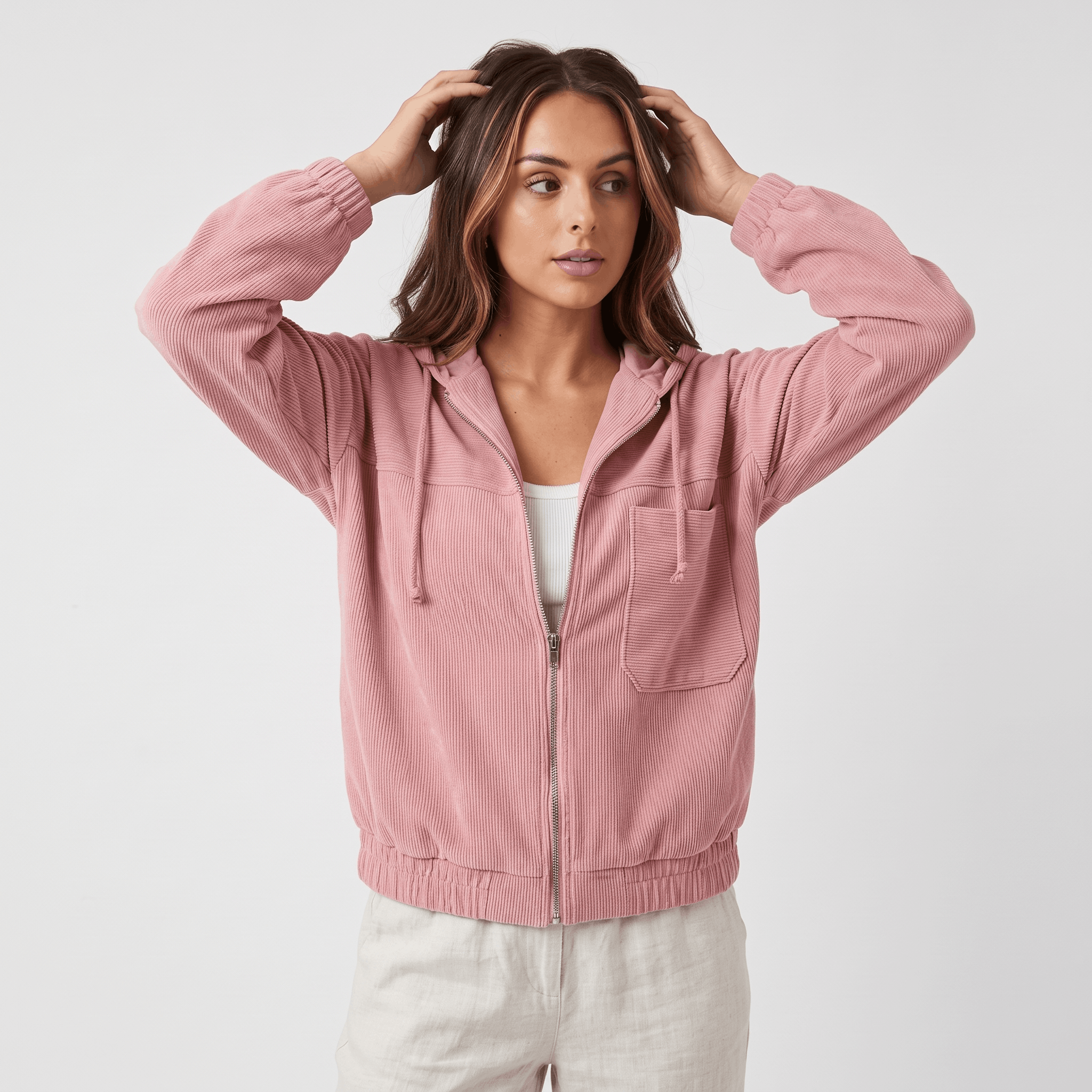 Dusty pink corduroy zip-up hoodie with a drawstring hood, elasticated cuffs, and a relaxed fit on a neutral background.