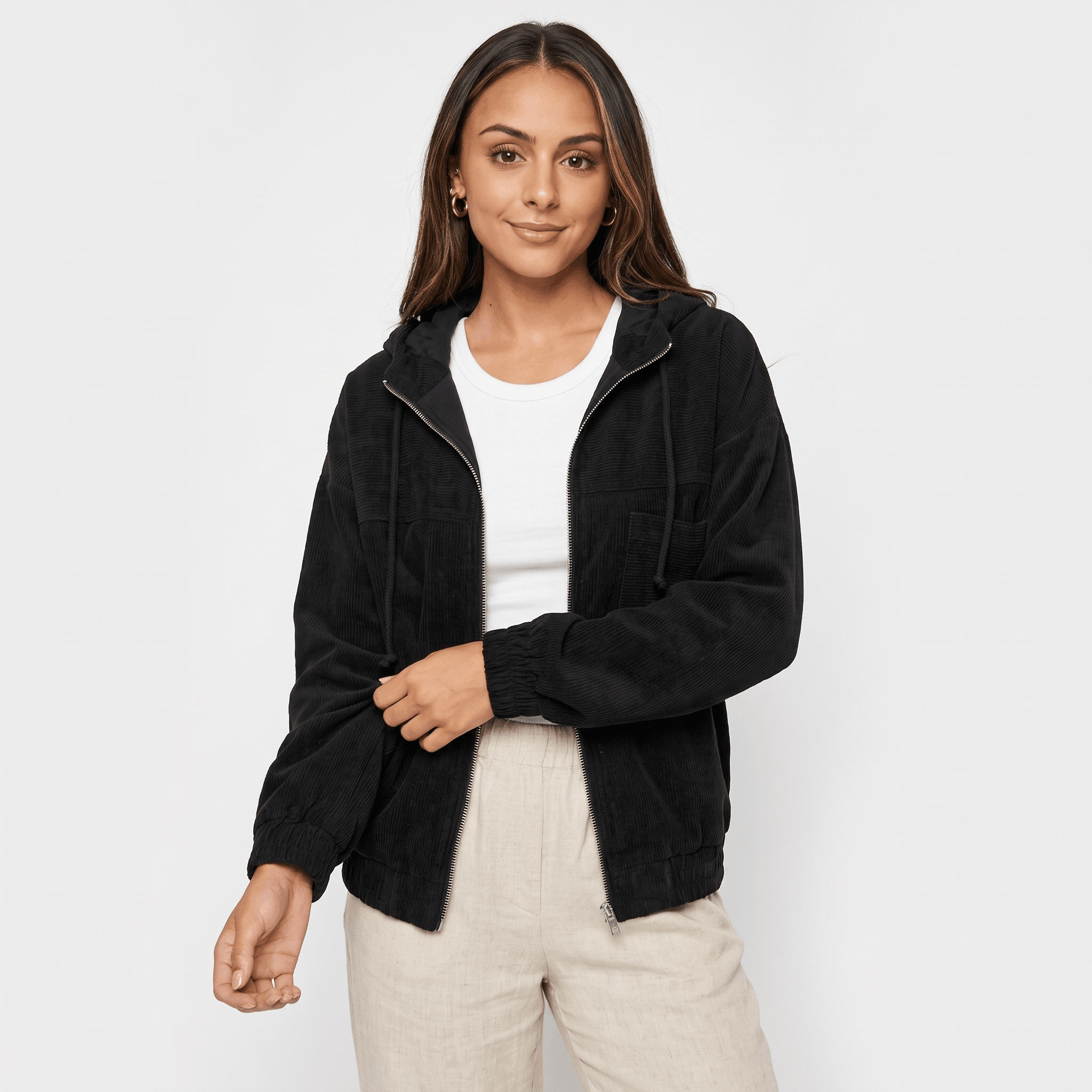 Black corduroy zip-up hoodie with a drawstring hood, elasticated cuffs, and a relaxed, textured layering fit.