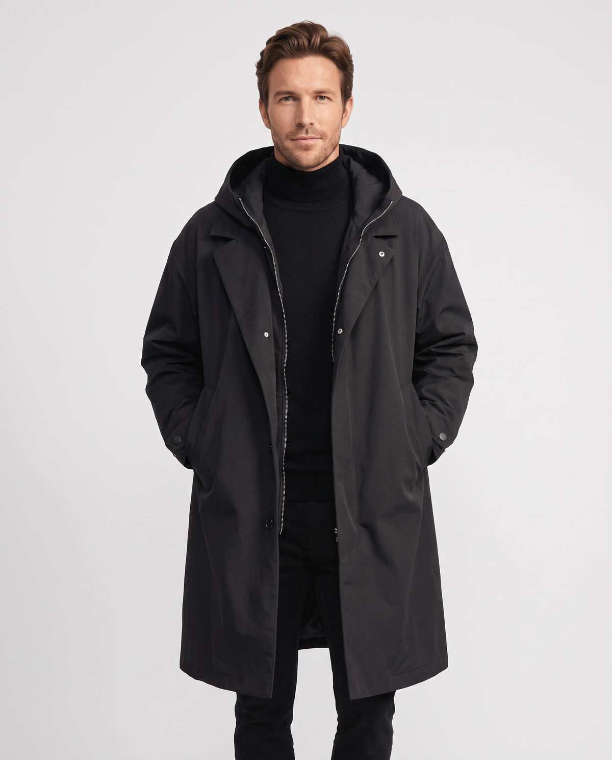 Black hooded long coat with notched lapels, zip closure, and front pockets worn by a male model