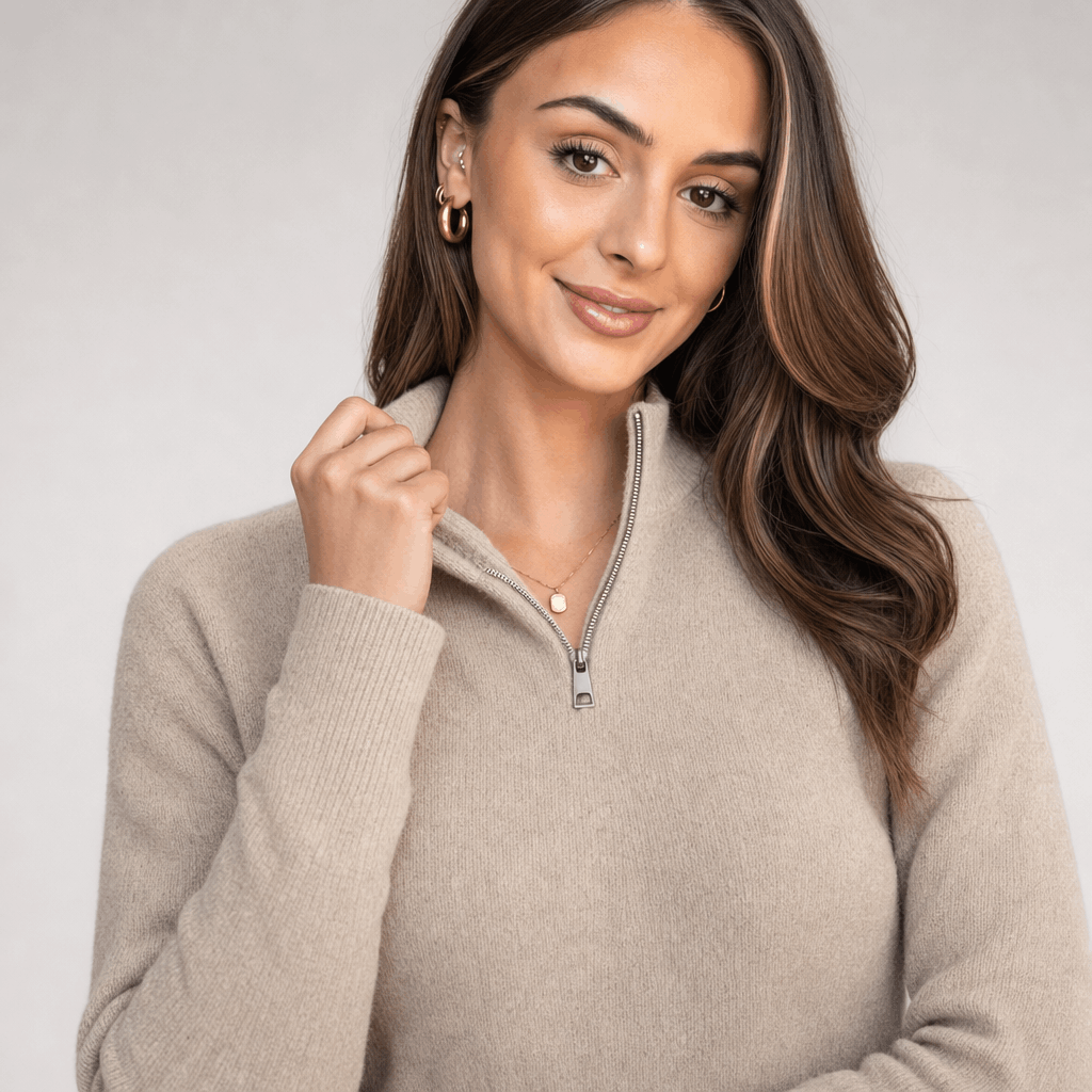 Close-up of the woman modeling the taupe ribbed half-zip sweater.