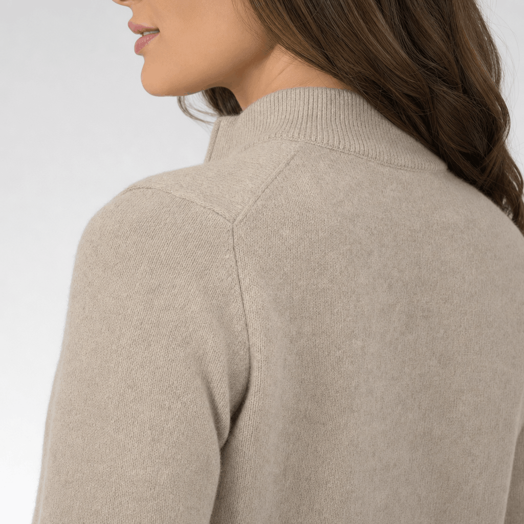 Back close-up showing the raised collar and ribbed knit texture of the taupe sweater.