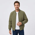Male model wearing an olive green bomber jacket over a white T-shirt with blue jeans.