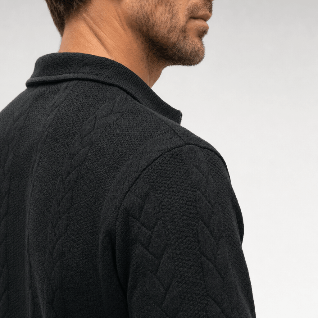 Close-up back view showing the black sweater's textured knit and collar.