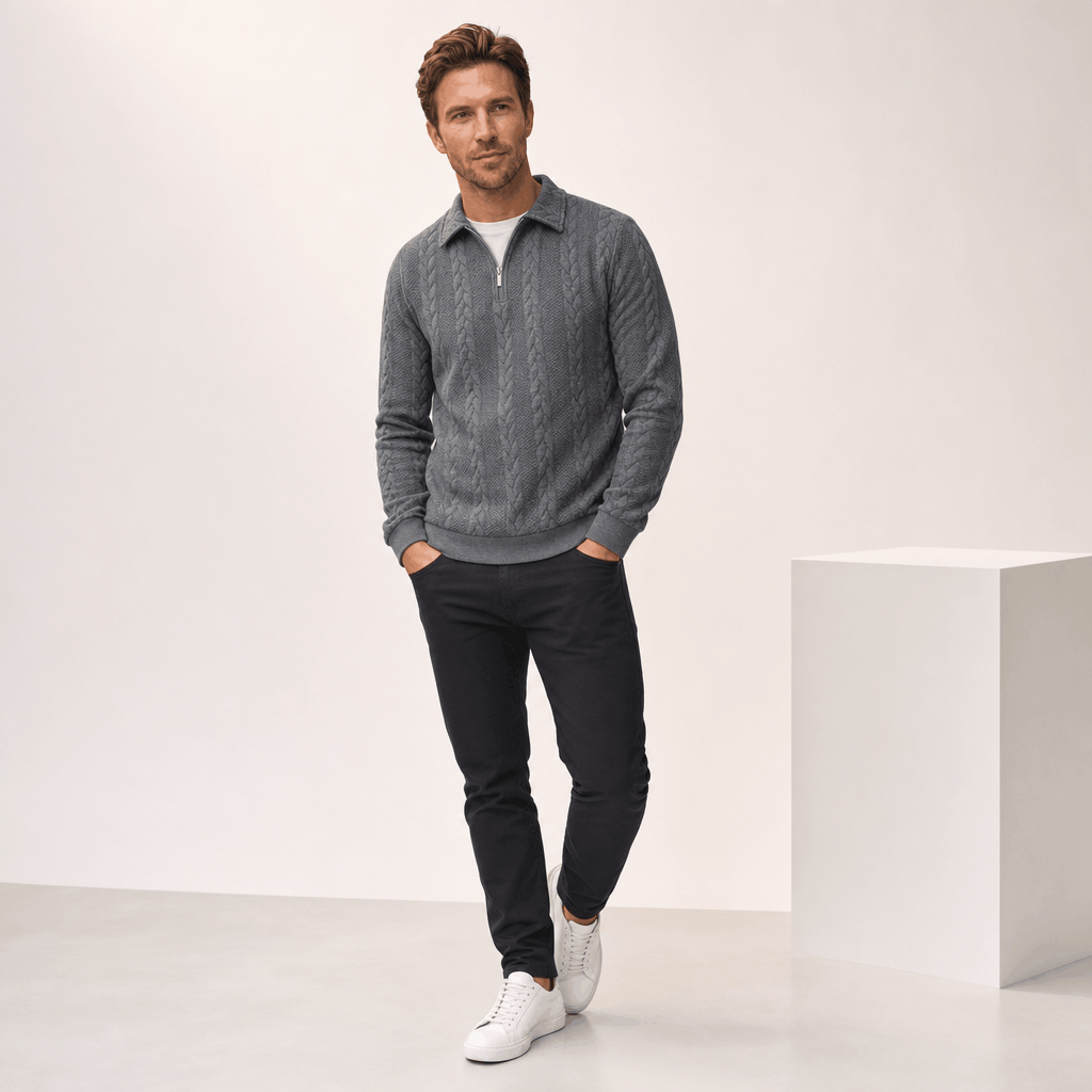 Grey cable-knit quarter-zip sweater with a point collar, ribbed cuffs, and a textured jacquard finish.