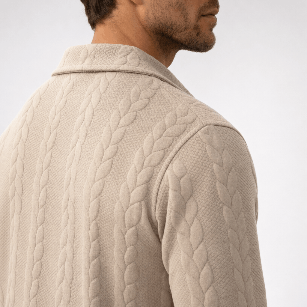 Close-up back view highlighting the cable-knit texture and raised collar.