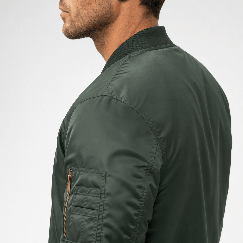 Side and back view of the dark green bomber jacket, highlighting the shoulder and sleeve pocket.