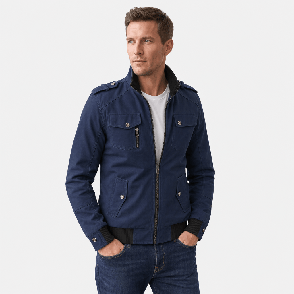 Male model wearing a navy blue zip-up utility jacket with buttoned chest pockets and zippered side pockets.