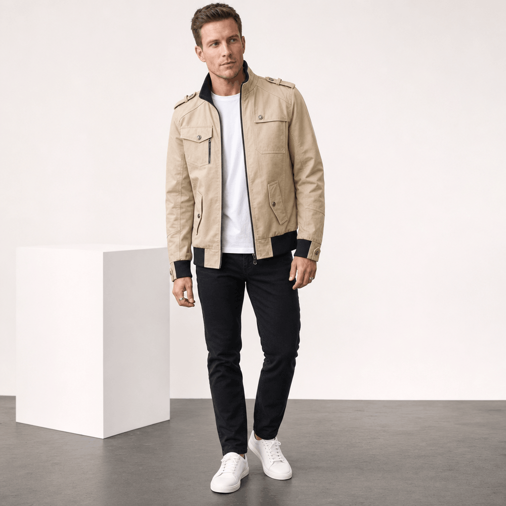 Male model wearing the beige jacket with dark trousers and white sneakers.