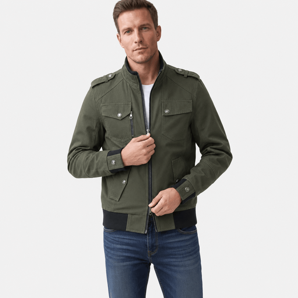 Male model wearing an olive green utility-style zip-up jacket with blue jeans.