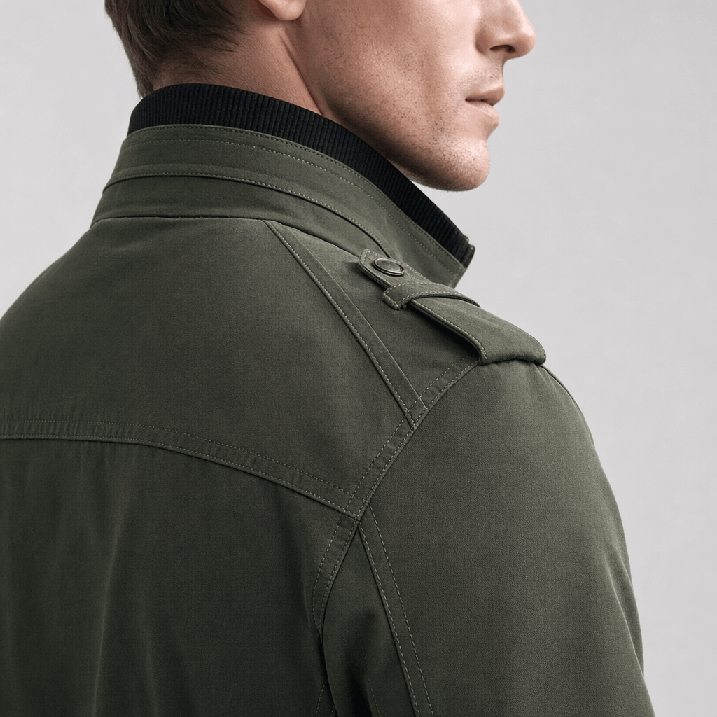 Detailed back and side view of the olive green jacket, highlighting the raised collar and shoulder seams.