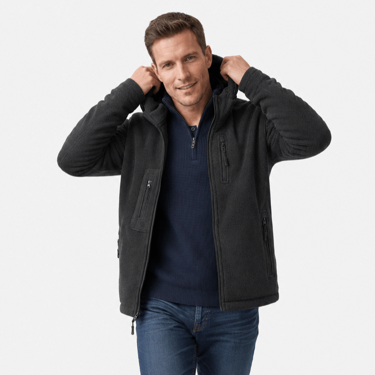 Male model wearing the dark charcoal hooded jacket while adjusting the hood.
