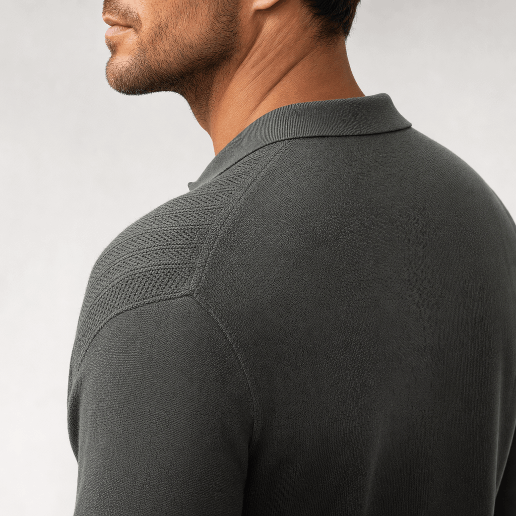 Charcoal grey quarter-zip polo sweater featuring textured openwork knit panels and a smooth, refined viscose blend finish.