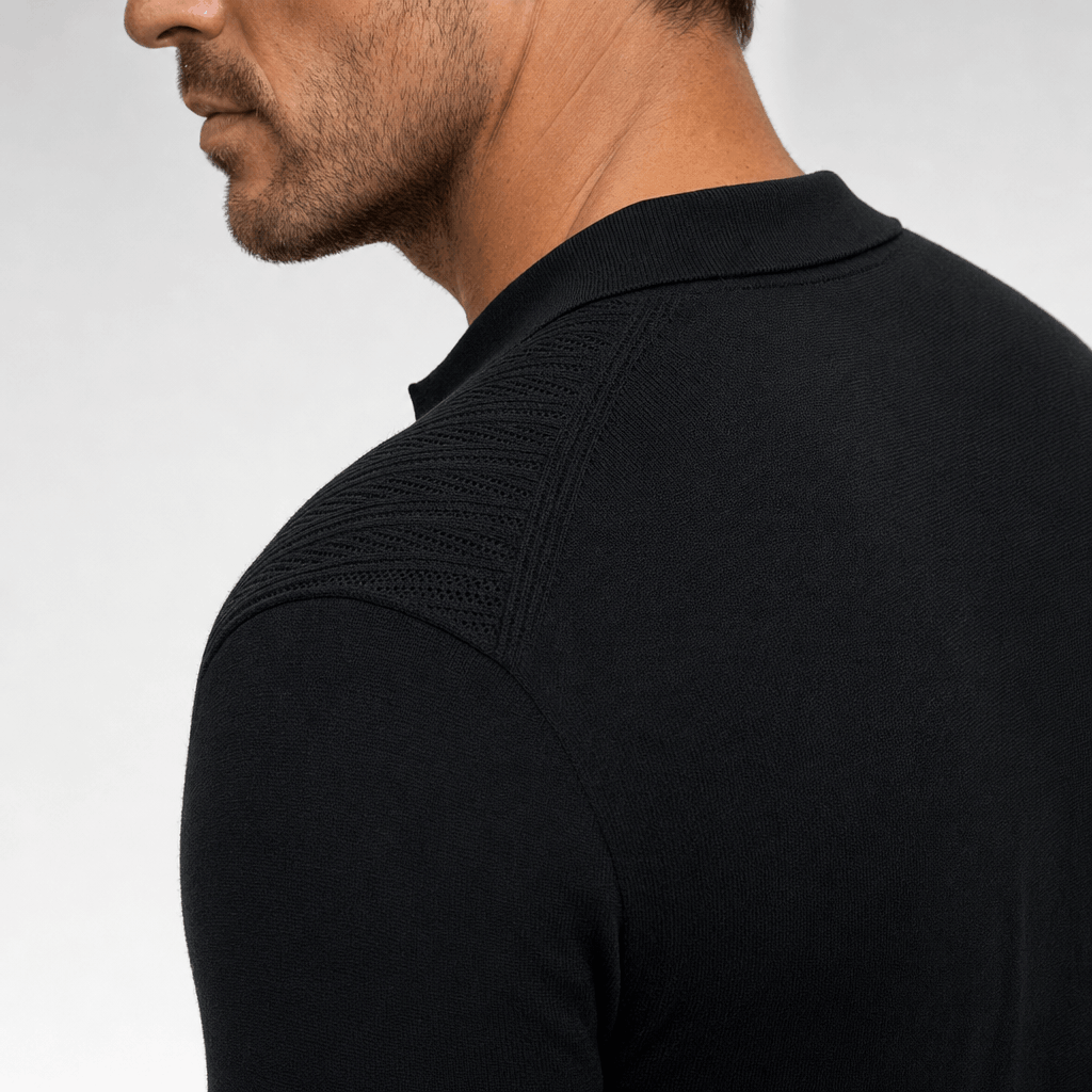 Black quarter-zip polo sweater featuring textured openwork knit panels on the shoulders and a smooth, refined viscose blend.