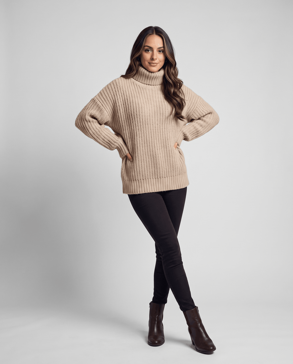 Dark Beige Merino Wool Turtleneck Sweater worn by a female model, featuring an oversized fit, high turtleneck collar, long sleeves, and ribbed cuffs.