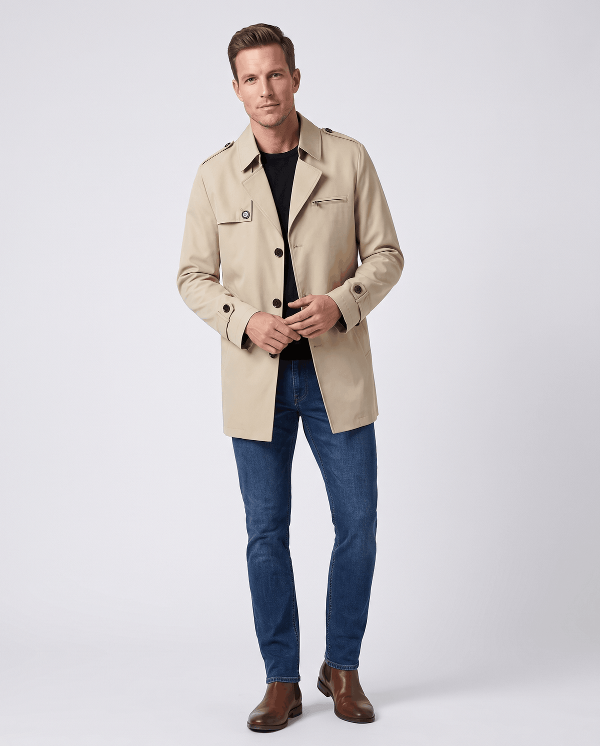 A man wearing a beige mid-length single-breasted trench coat with a lightweight design, button front, and tailored fit