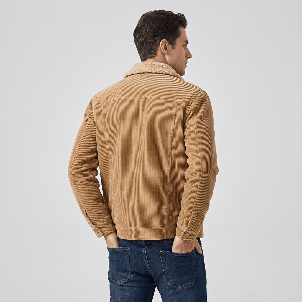 Tan cotton corduroy jacket with a sherpa-lined turn-down collar, worn over dark denim jeans against a neutral background.