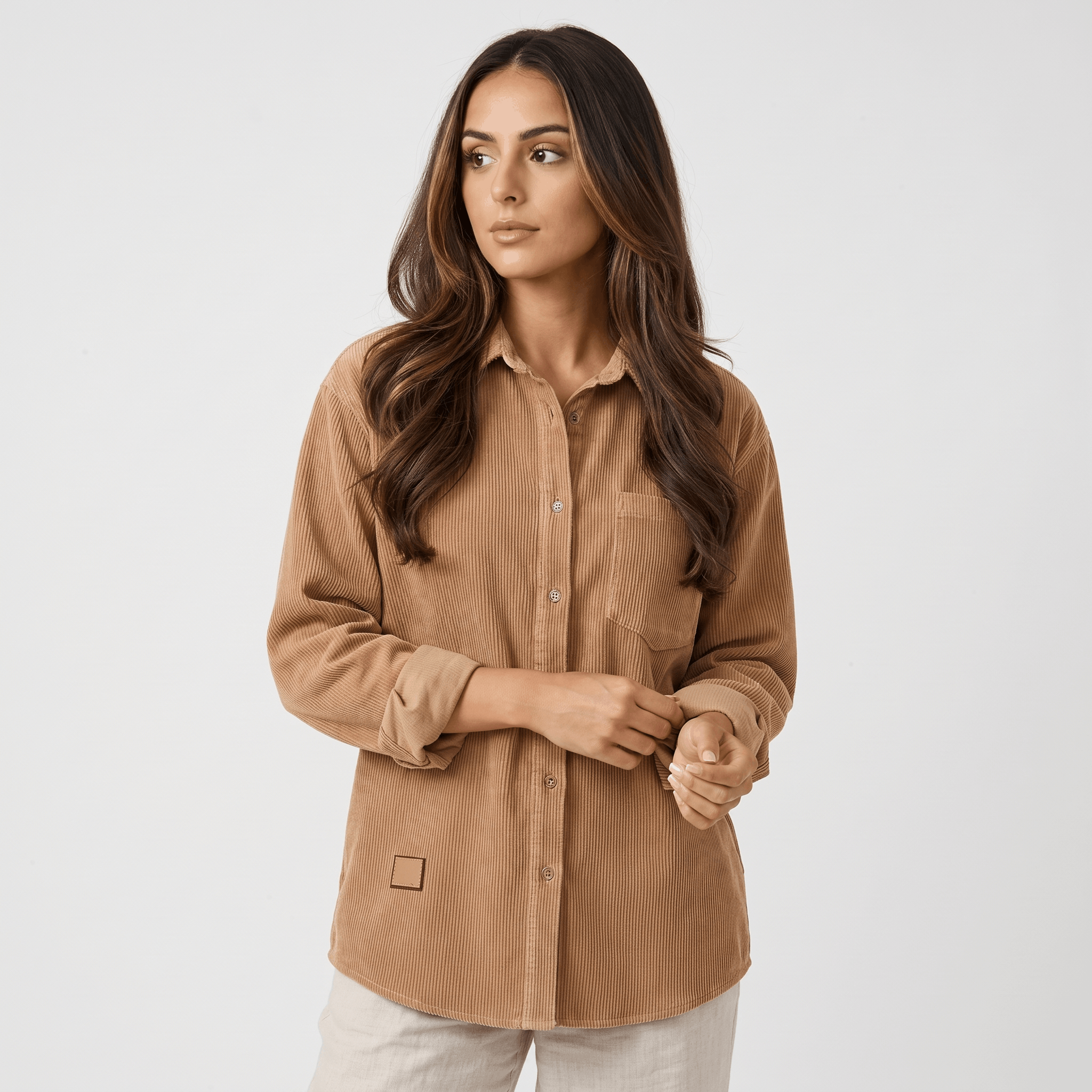 Beige fine wale corduroy button-down shirt with a relaxed fit, point collar, and long sleeves on a model.