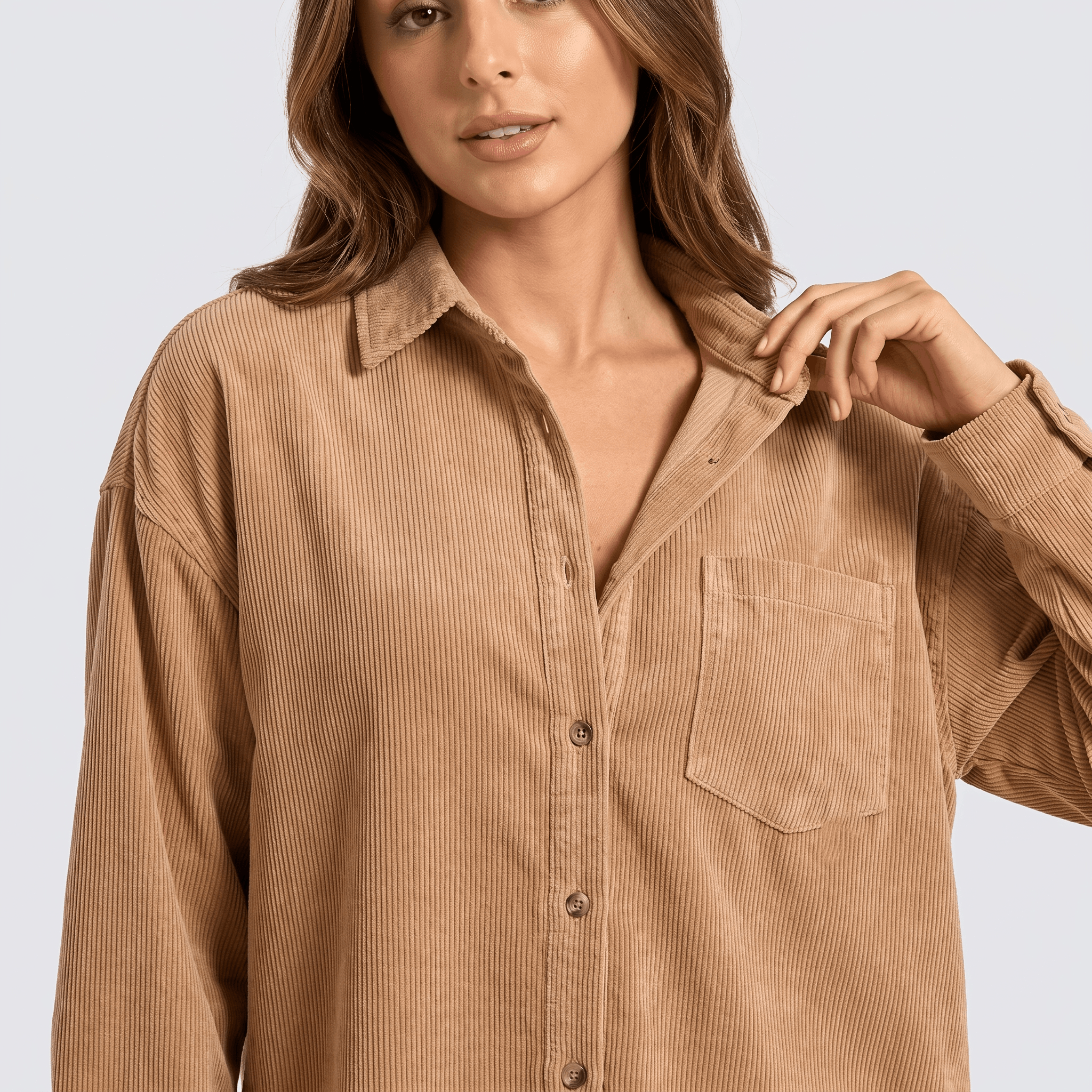 Beige fine wale corduroy button-down shirt with a relaxed fit, point collar, and chest pocket.