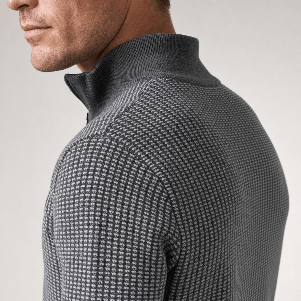 Close-up showing the raised collar and textured knit detail of the medium gray sweater.