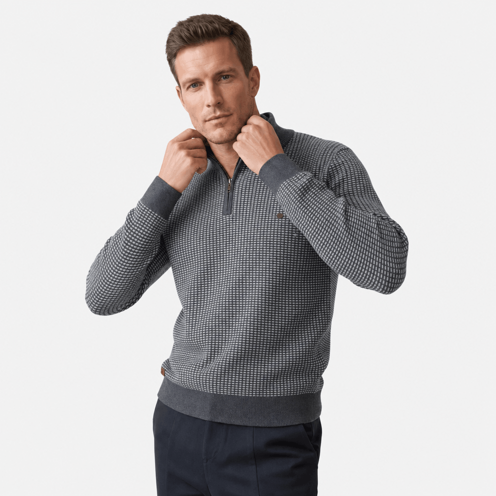 Man wearing a medium gray textured half-zip sweater, shown adjusting the collar.
