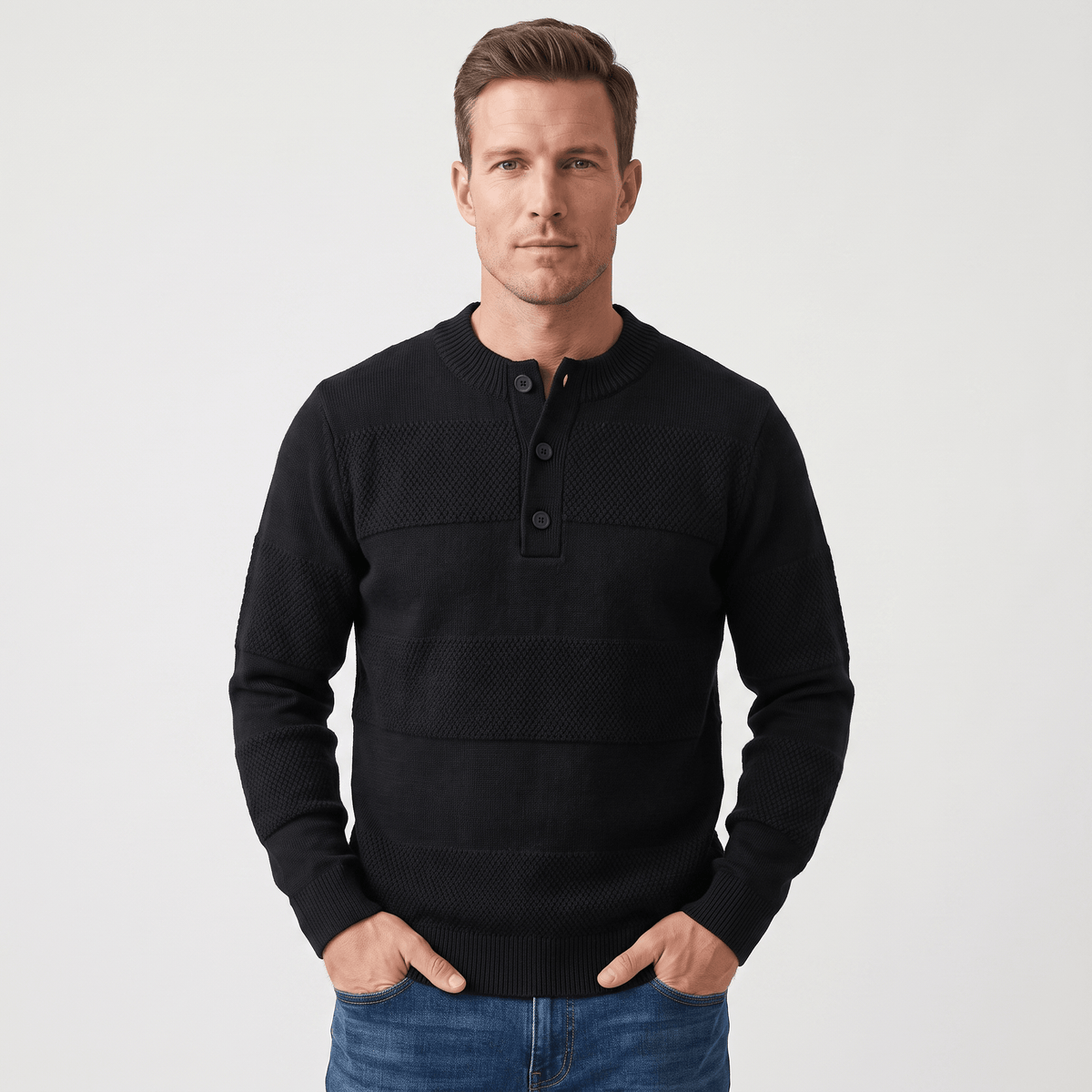 Black chunky knit henley sweater featuring alternating smooth and raised textured stripes with a three-button placket.