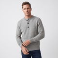 Grey chunky knit henley sweater featuring alternating textured stripes, a three-button placket, and ribbed trim.