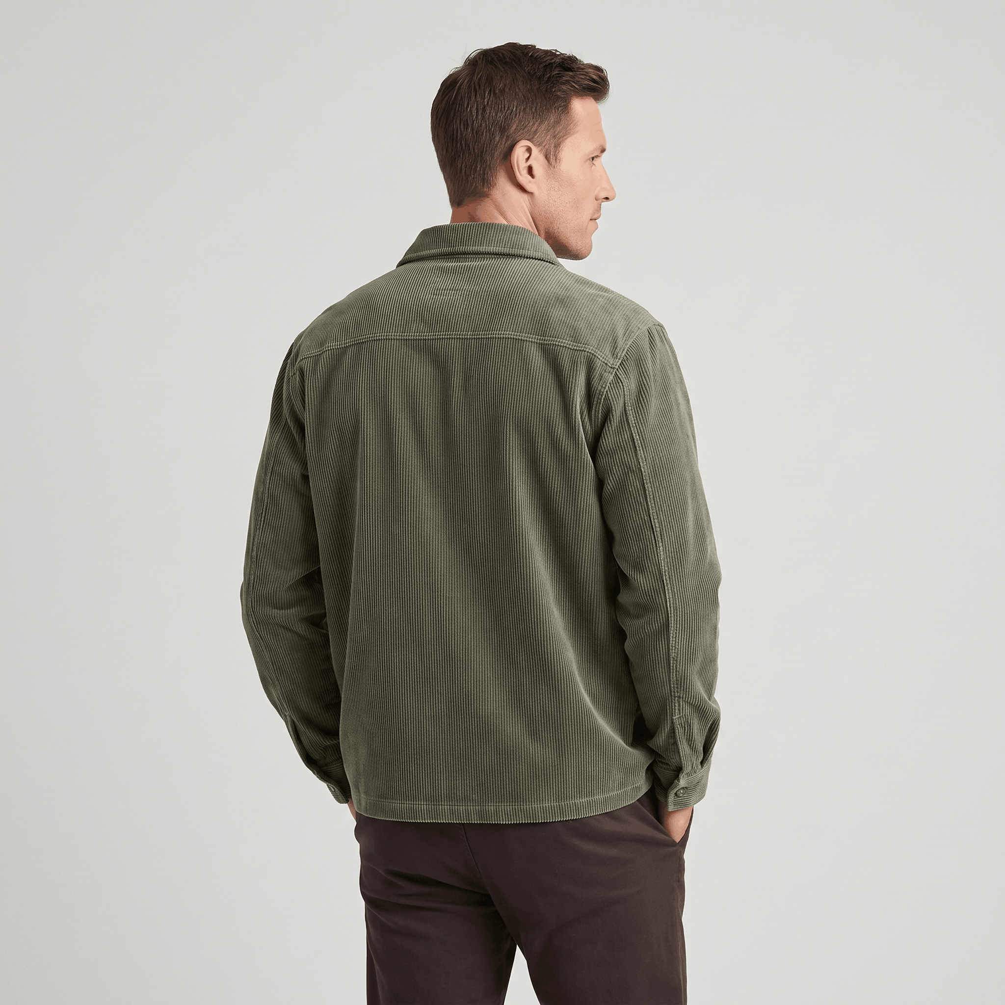 Olive green corduroy shirt jacket with a relaxed fit and soft, washed texture, shown from the back.