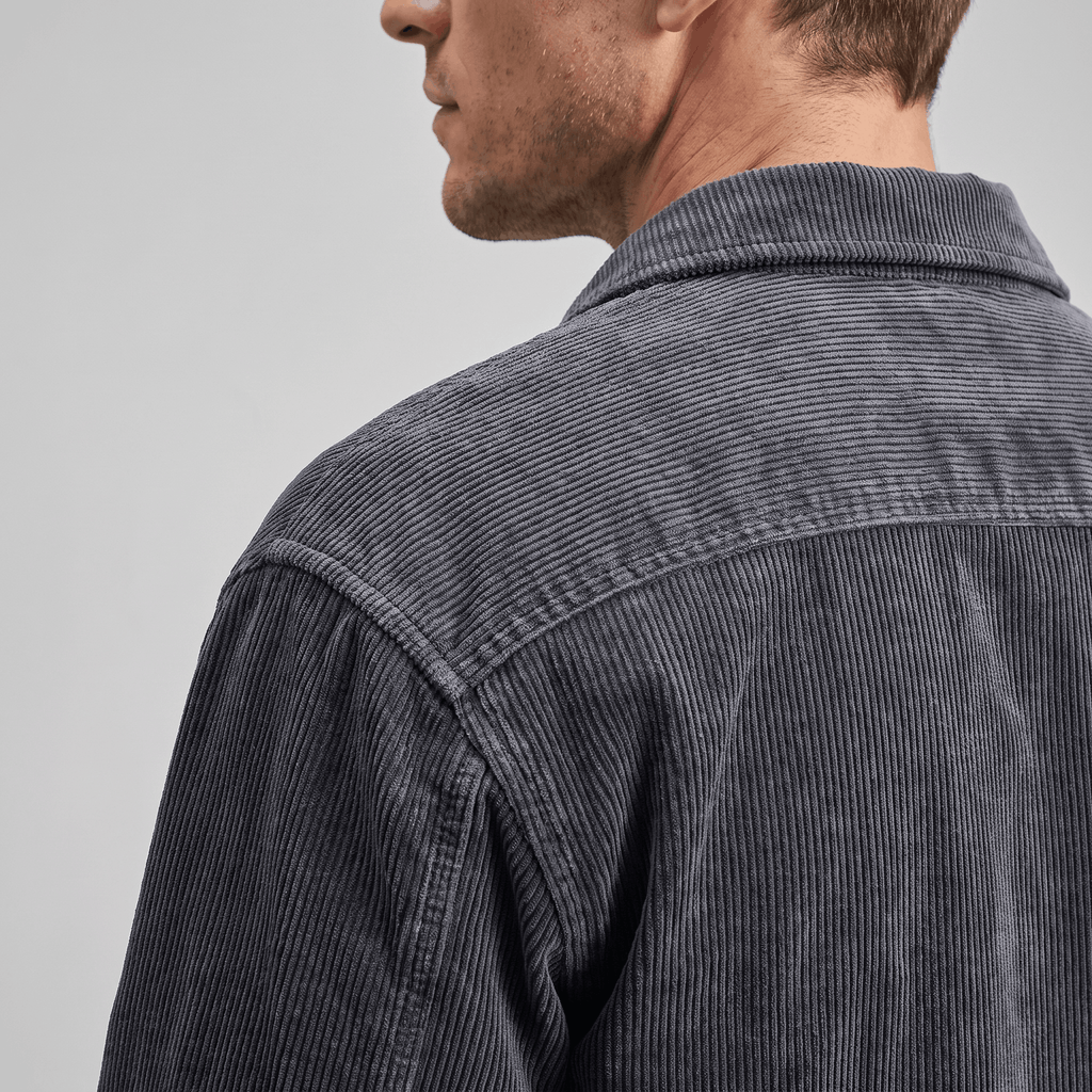 Charcoal grey corduroy shirt jacket featuring a soft, washed texture and a relaxed, comfortable fit across the shoulders.