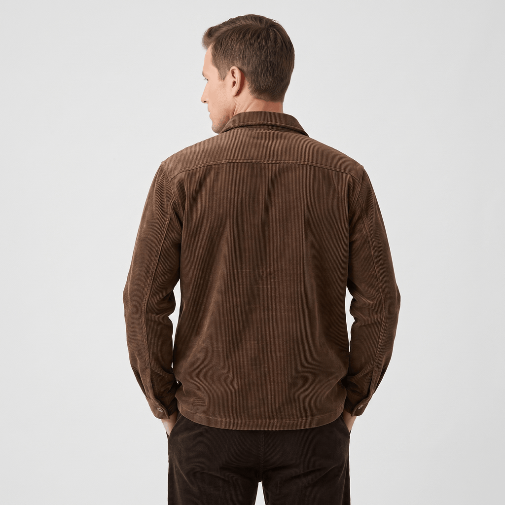 Brown corduroy shirt jacket with a relaxed fit, featuring a soft washed texture and structured collar, worn from behind.