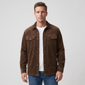 Brown corduroy shirt jacket with four pockets and antiqued buttons, worn over a white tee in a relaxed fit.