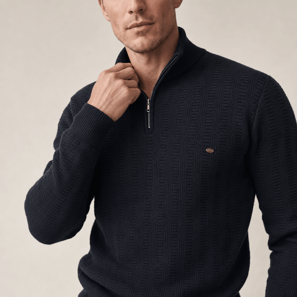 Close-up showing the half-zip collar and textured knit detail of the black sweater.