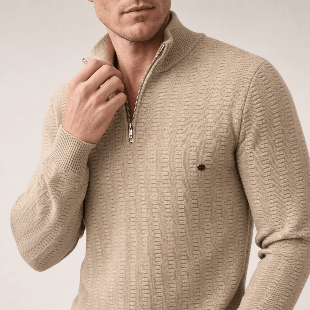 Close-up showing the half-zip neckline and textured knit pattern of the beige sweater.
