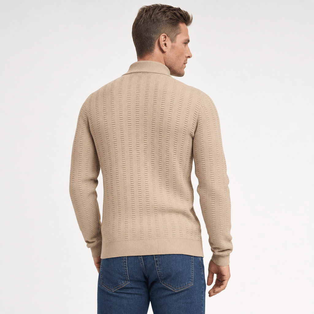 Back view of the man wearing the beige textured half-zip sweater with jeans.
