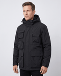 A man wearing a black parka jacket with warm padded lining, a hood, and multiple front pockets