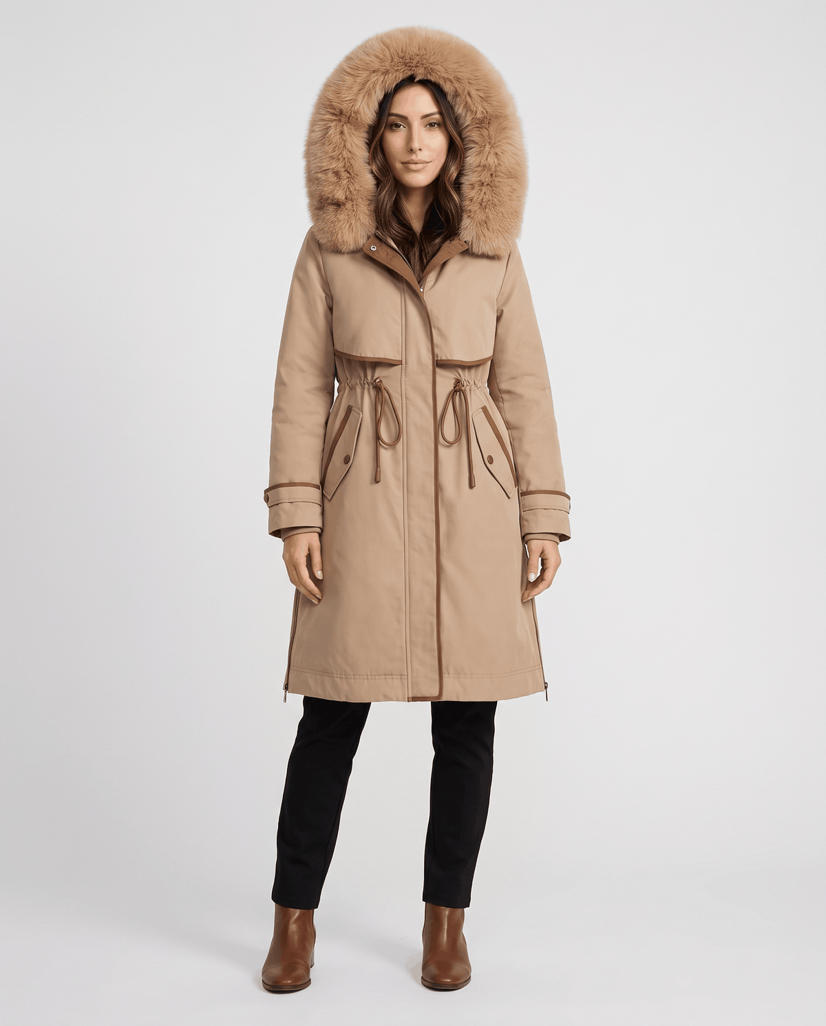 A woman wearing a beige winter parka with a plush fur-trimmed hood, cozy lining, and adjustable waist