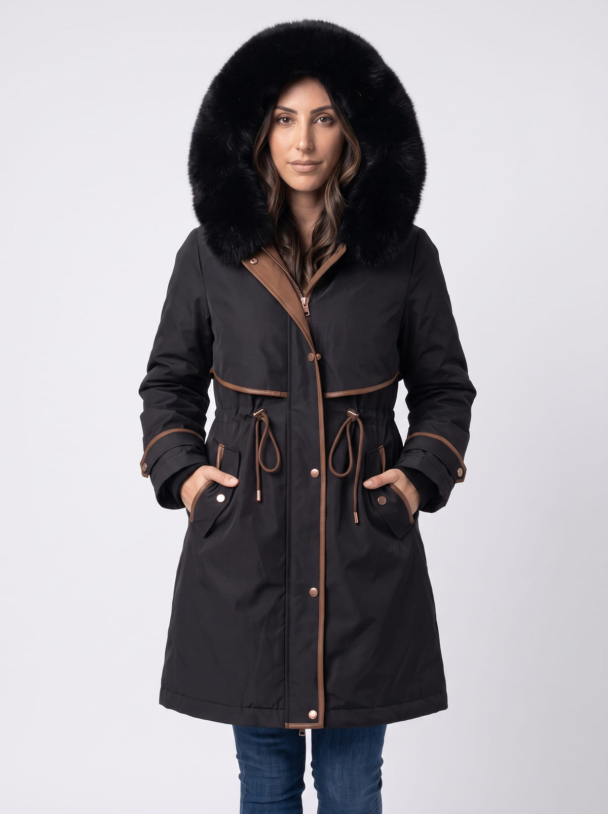 Black plush hood trim winter parka with belted waist and front pockets worn by a female model