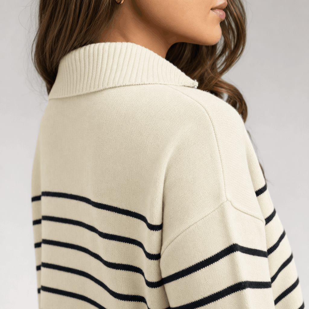 Back and side view of the cream quarter-zip sweater, showing the stripe pattern across the back and sleeves.