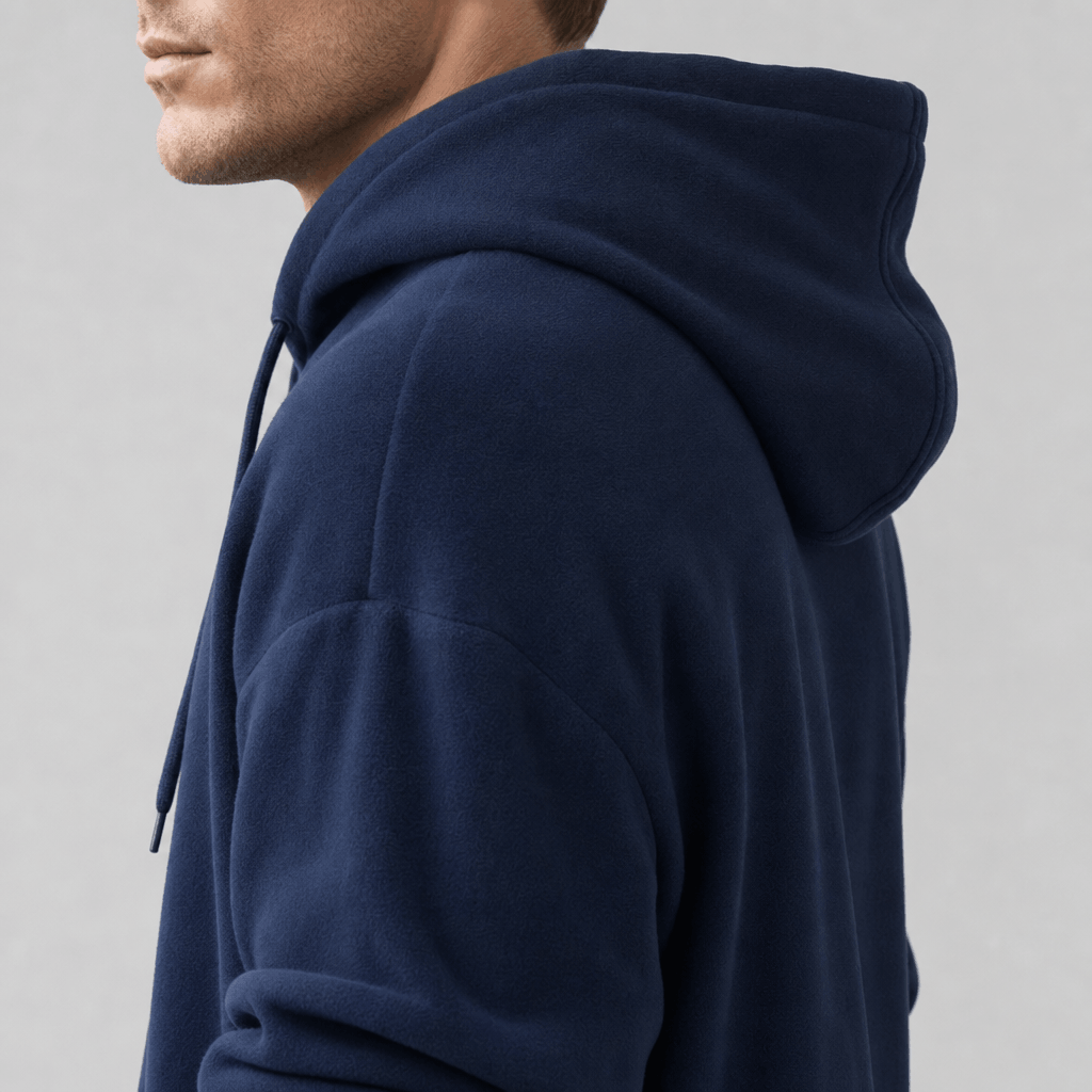 Close-up side and back view of the navy blue hoodie, highlighting the hood and shoulder.