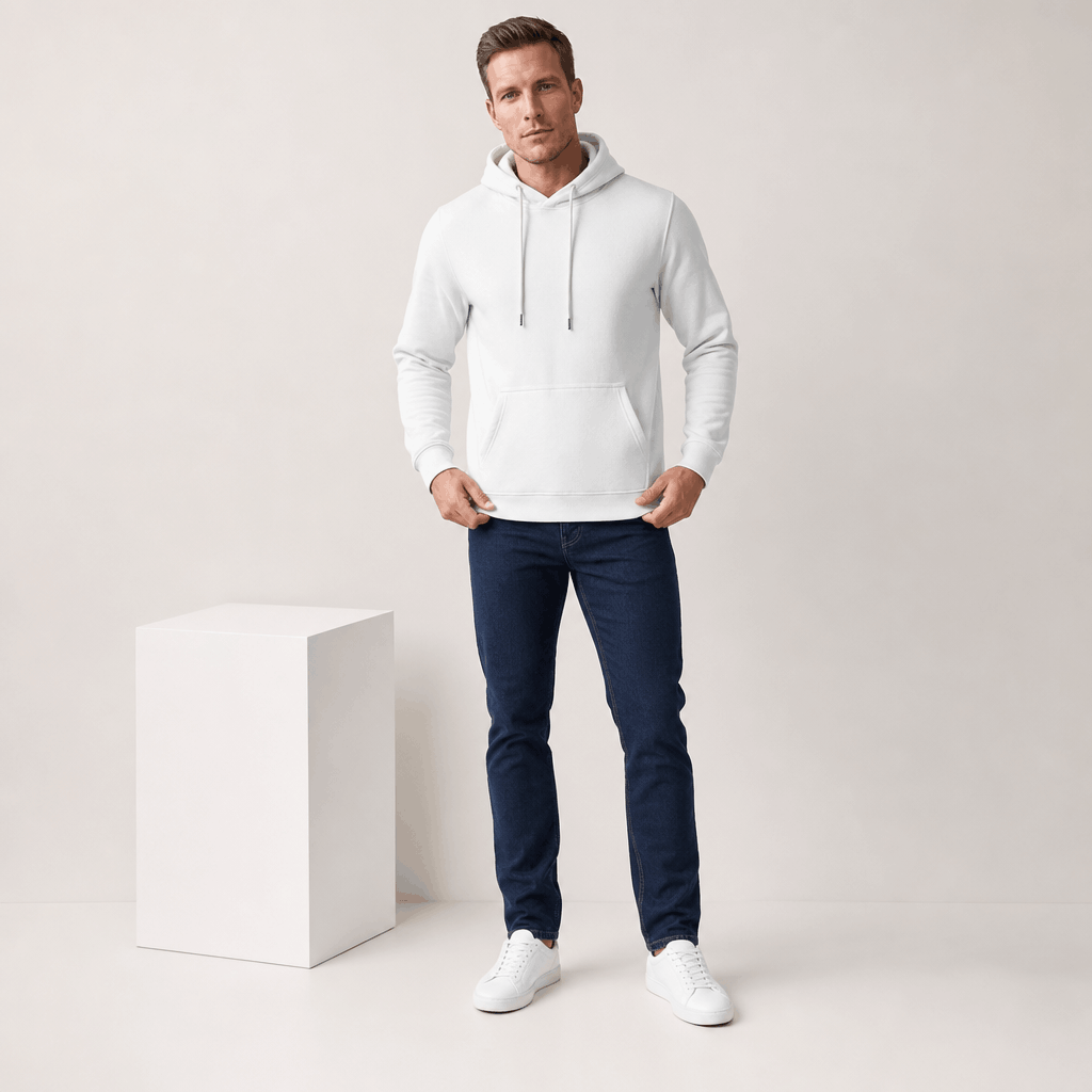 Male model wearing the white pullover hoodie with blue jeans and white sneakers.