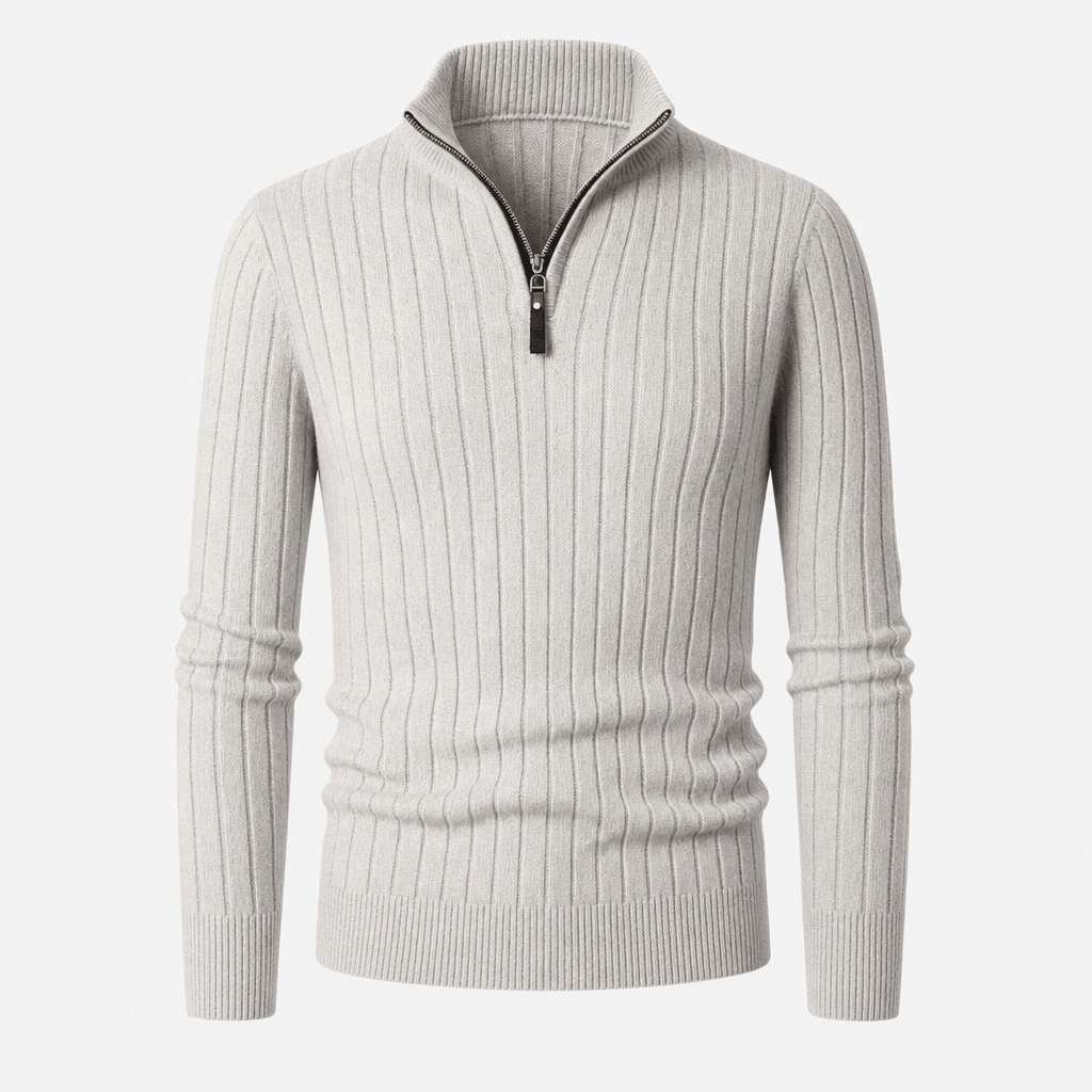 Ivory ribbed half-zip sweater displayed on its own, showing the front and ribbed hem.